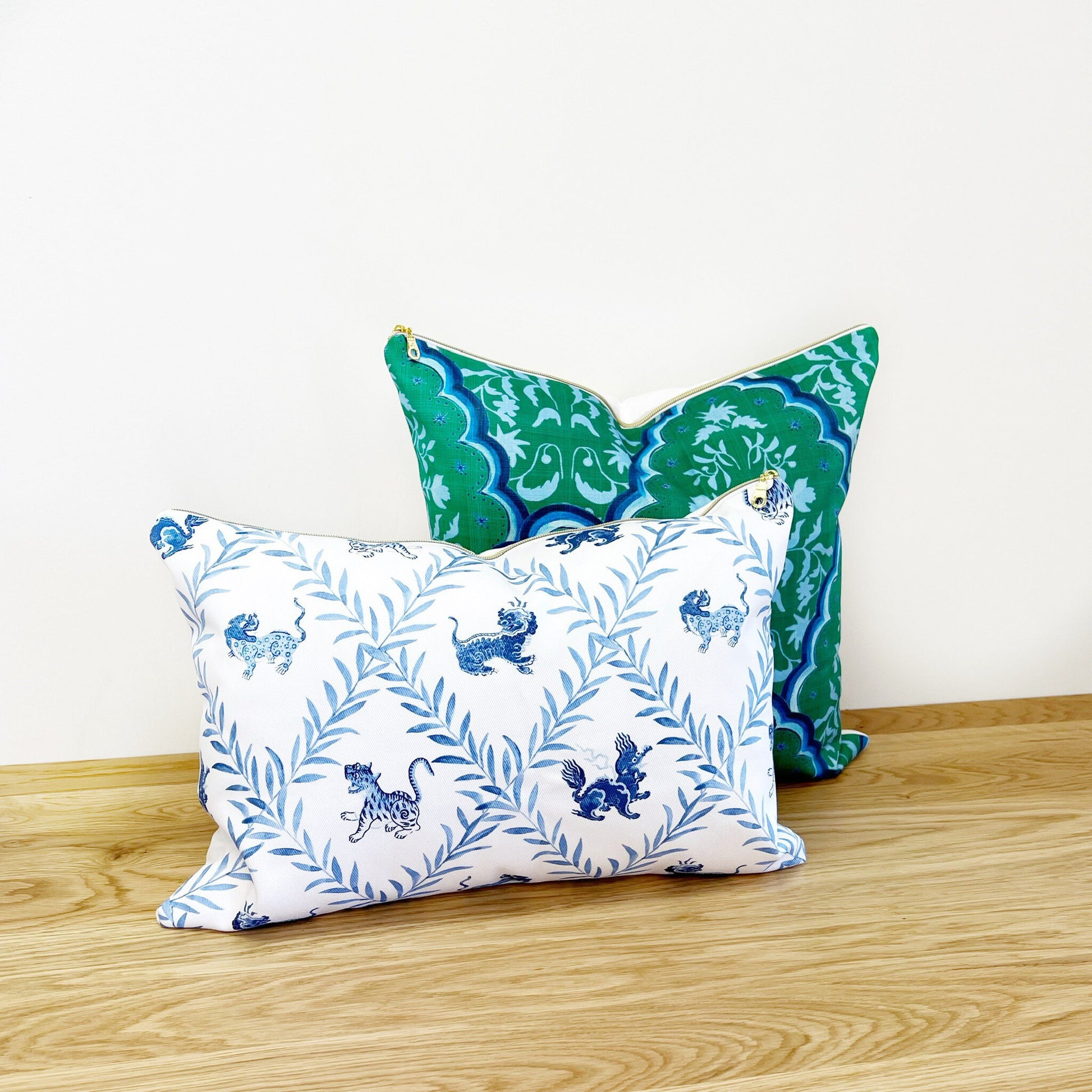 Designer Curated : Little Beasties + Scallop Paisley blue and green throw pillows by Danika Herrick